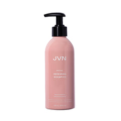 Botella de JVN Revive Reparador Champú mostrando su envase, ideal para cabello dañado.