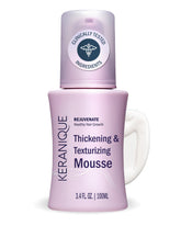 Keranique Volumizing Mousse bottle tilted for instant volume.
