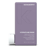 KEVIN.MURPHY HYDRATE-ME.RINSE, botella vertiendo, hidrata cabello seco y suave.