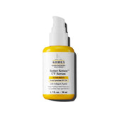 Kiehl's Better Screen Serum en bote de vidrio reciclado, protección diaria sostenible.