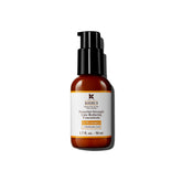 Kiehl's Sérum Vitamina C 12-5% en botella, iluminación natural de la piel.