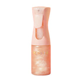Kopari bruma corporal rose dorado con brillo suave para piel iluminada.