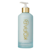 Kopari Crème Corps Soie Hydratante en flacon, hydratation durable pour peau sèche.
