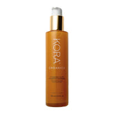 KORA Organics nettoyant moussant éclat curcuma, flacon clair et purifiant.