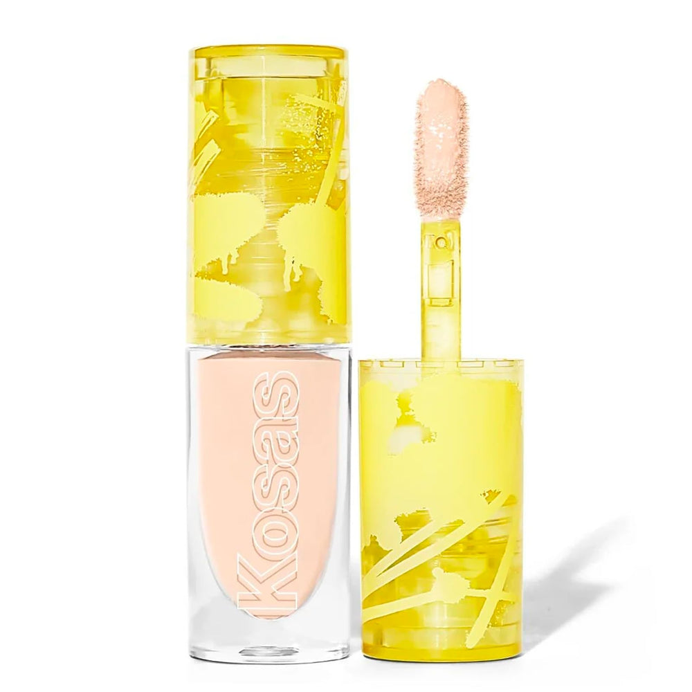 Kosas Revealer en bote ofrece cobertura suave para un look natural.