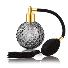 Lamoutor botella de perfume vintage en cristal negro con borla larga, estilo sofisticado.