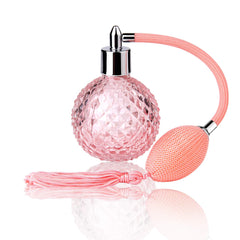 Lamoutor frasco de perfume vintage rosa en cristal con borla decorativa.