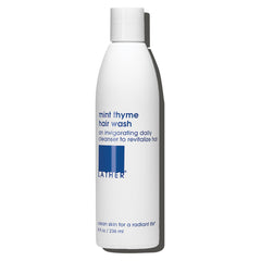 LATHER Lavado de Cabello Menta Tomillo, botella con aroma vigorizante para uso diario.