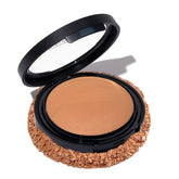 Envase de Laura Geller New York Baked Double Take Sand muestra cobertura duradera.