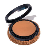 Laura Geller New York Base en polvo Deep con subtonos dorados para tono profundo.
