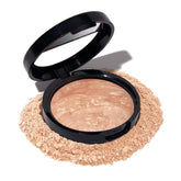 Laura Geller New York – poudre équilibrante pour une application légère et naturelle.