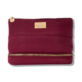 Laura Geller New York sac maquillage matelassé bourgogne, extérieur chic et résistant.