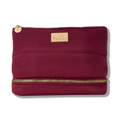 Laura Geller New York sac maquillage matelassé bourgogne, extérieur chic et résistant.