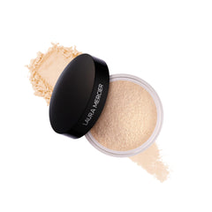 Laura Mercier Poudre libre translucide — packaging élégant qui fixe durablement le maquillage.