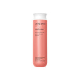 Living Proof Acondicionador para rizos, botella vertida, hidrata y facilita la distribución.
