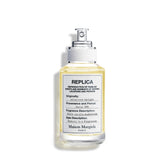 Maison Margiela Replica Afternoon Delight, frasco-vertido, experiencia cálida para tardes de otoño.