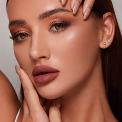 Applying MAKI YIKA Brown Nude Lipstick for bold, even lip color