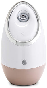 Vaporizador Microderm GLO en uso sobre el rostro para hidratación profunda.