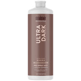 MineTan Spray Tan Ultra Oscuro en botella para bronceado profesional.