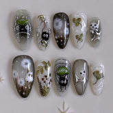 Uñas falsas MINGCHUN claras en almendra corta con diseño diente de león para elegancia diaria.