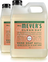 Mrs. Meyer's Clean Day Geranium hand soap refill 33 oz two-pack on a sink for fresh hands.