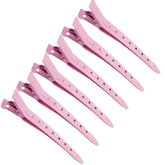 Pinza MtnLaur rosa pico de pato para fijar mechones con precisión.