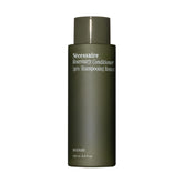 Nécessaire Rosemary Conditioner sur bouteille plan de travail, démêlage facilité.