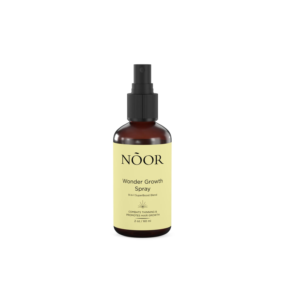 NOOR HAIR Wonder Growth Spray: bouteille élégante prête pour une utilisation quotidienne.
