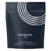 Nutrafol Men cápsulas junto al frasco para crecimiento capilar