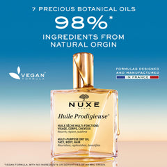 Nuxe Huile Prodigieuse, botella en escaparate, ideal para cabello nutrido y brillo natural.