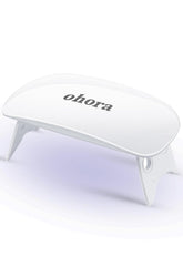 Ohora Care LED lamp front view, compact for on-the-go gel strip curing.