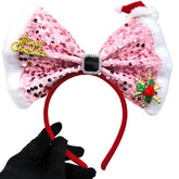 La diadema OIUUBBII con lazo rosa brillante para fiestas navideñas.