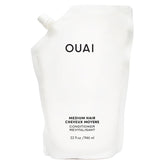 OUAI condicionador medio: envase recargable para cuidado eficiente del cabello.