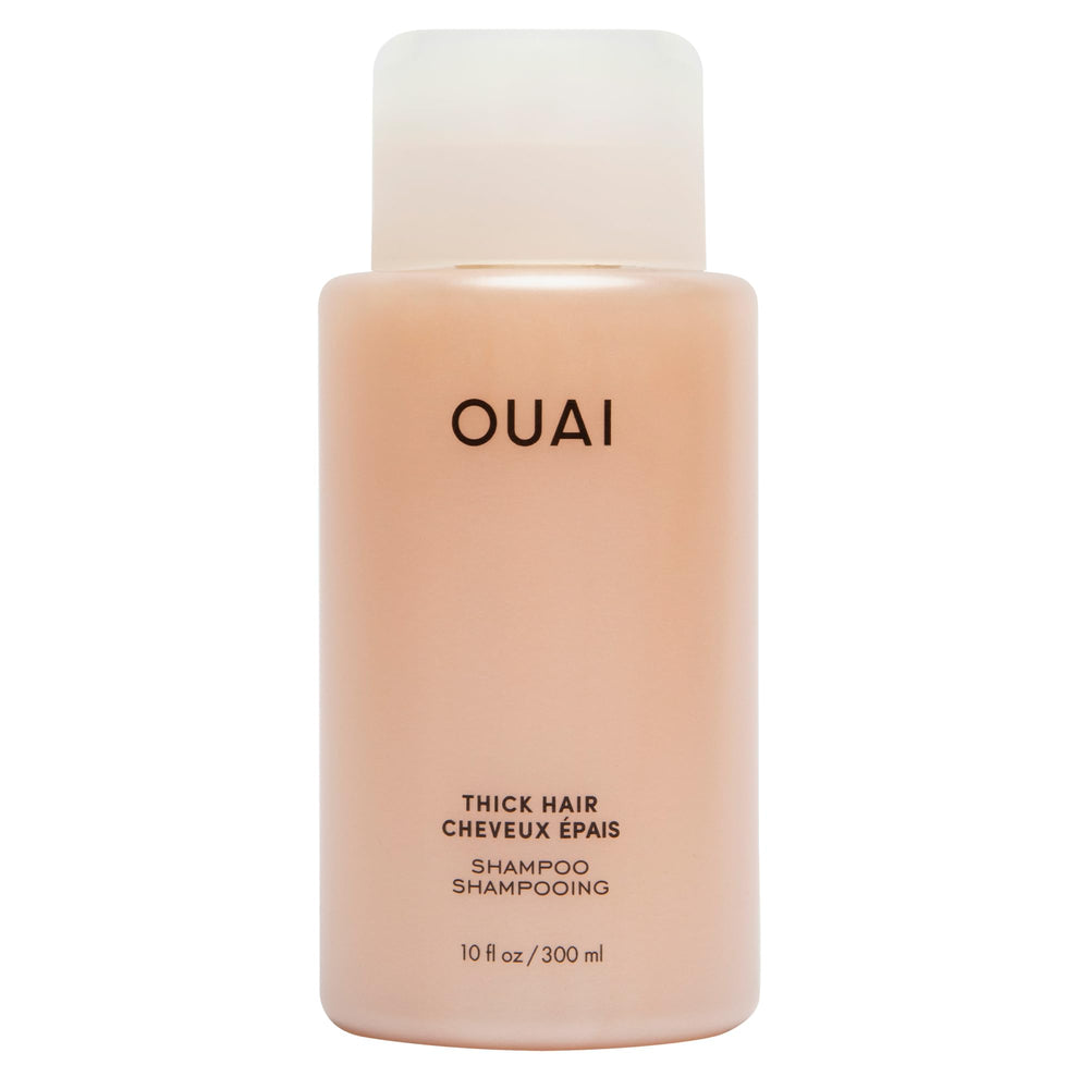 Shampooing OUAI épais: bouteille brillante prête à hydrater les cheveux.