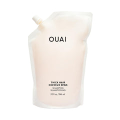 OUAI Thick Shampoo frente de botella, suaviza mechones gruesos y controla el encrespamiento.