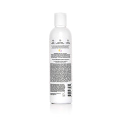 Textura crema morada del acondicionador para cabello suave e hidratado.