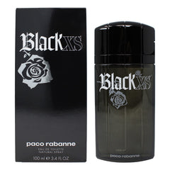 Paco Rabanne Black XS, botella alta frente, aroma intenso para noches audaces y confianza.