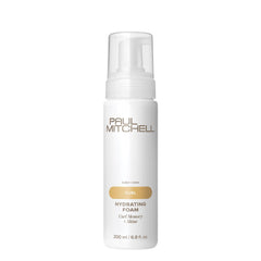 Espuma hidratante de Paul Mitchell para rizos con memoria y brillo.