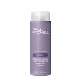 Shampooing violet platine Paul Mitchell dans sa bouteille, neutralise les reflets jaunes.