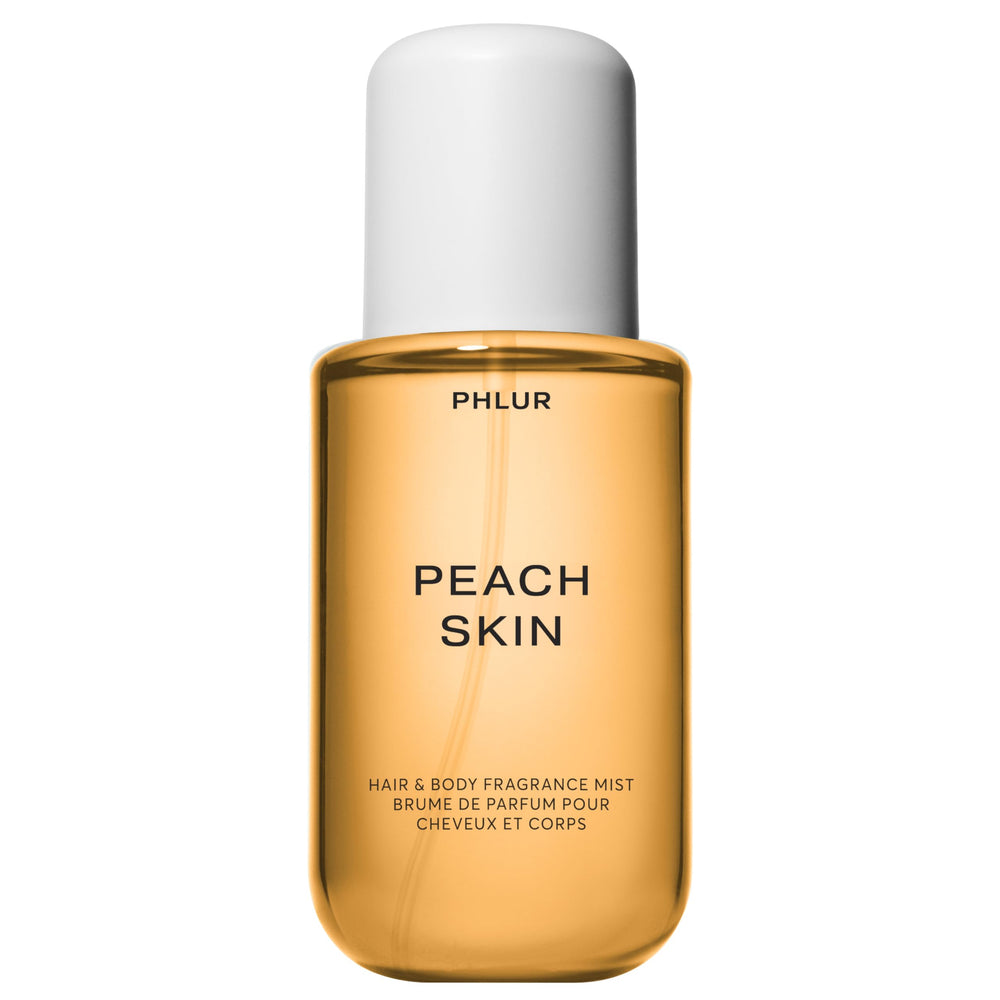 PHLUR Peach Skin Body Mist en botella elegante para uso diario suave.