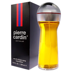 Pierre Cardin applying perfume to skin for lingering aroma.