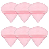 Esponja Pimoys para polvo con diseño triangular rosa, ideal para base y contorno.