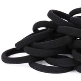 Qarwayoc coletas elásticas negras sujetan el cabello grueso sin tirar.
