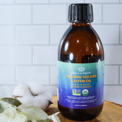 QUEEN OF THE THRONES Organic Golden Castor Oil amber glass packaging preserves quality.