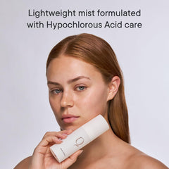 Qure Dermal Mist spray application showing gentle use on skin