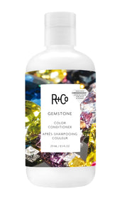 R+Co Gemstone Color Conditioner, botella vertida, ayuda a sellar color y brillo.