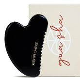 Rena Chris gua sha obsidiana frente para mejorar la relajación facial y circulación.