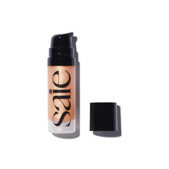 Saie Sunglow Mini Glowy en botella, brillo ligero para un rostro radiante.