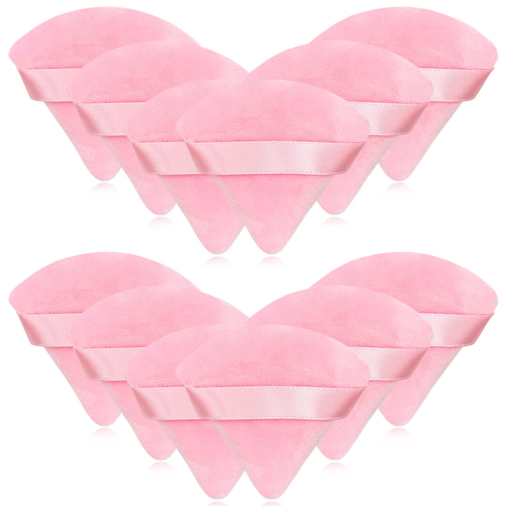 Puf triangular rosa Scartink de terciopelo para polvo suelto, acabado suave.