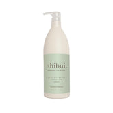 SHIBUI Shampoing Ultra Hydratant bouteille ouverte, hydratation légère pour cheveux texturés.